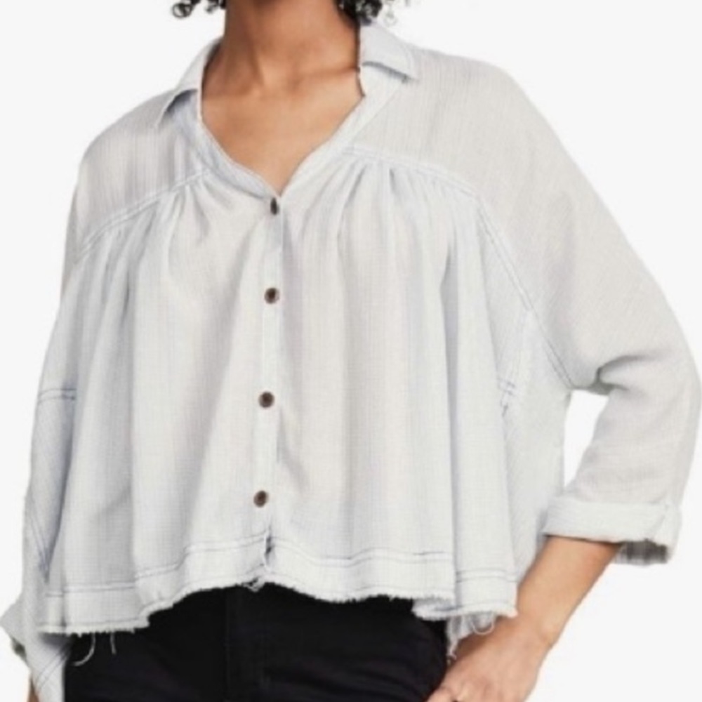 We The Free light blue top, size medium. Rolled half sleeves, raw hem. 22”L 33”W